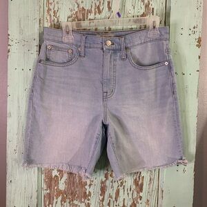 Women’s Madewell blue high rise mid length denim shorts with frayed hem